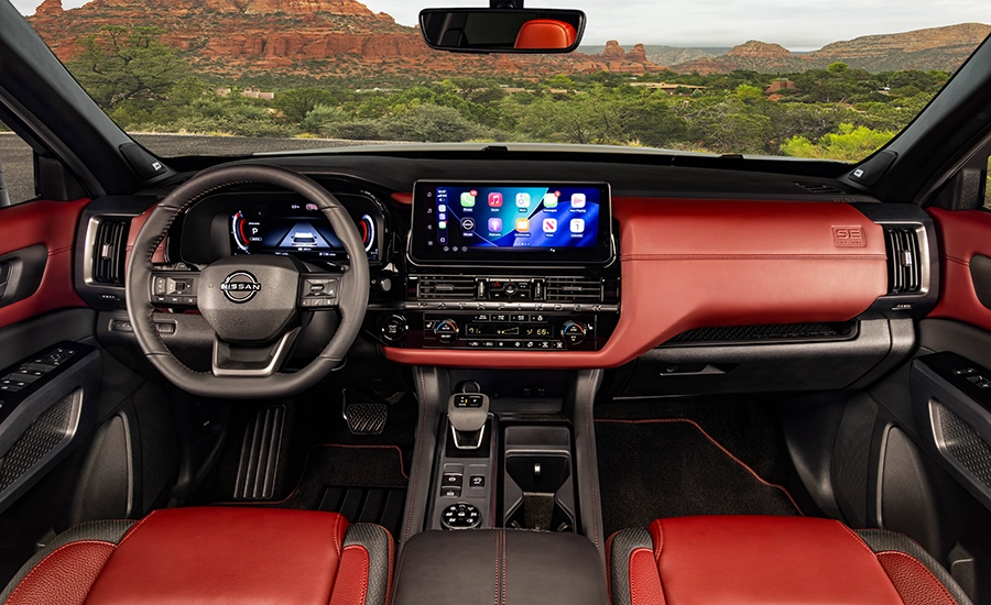 2027 Nissan Pathfinder Special Edition burgundy and black interior and dashboard
