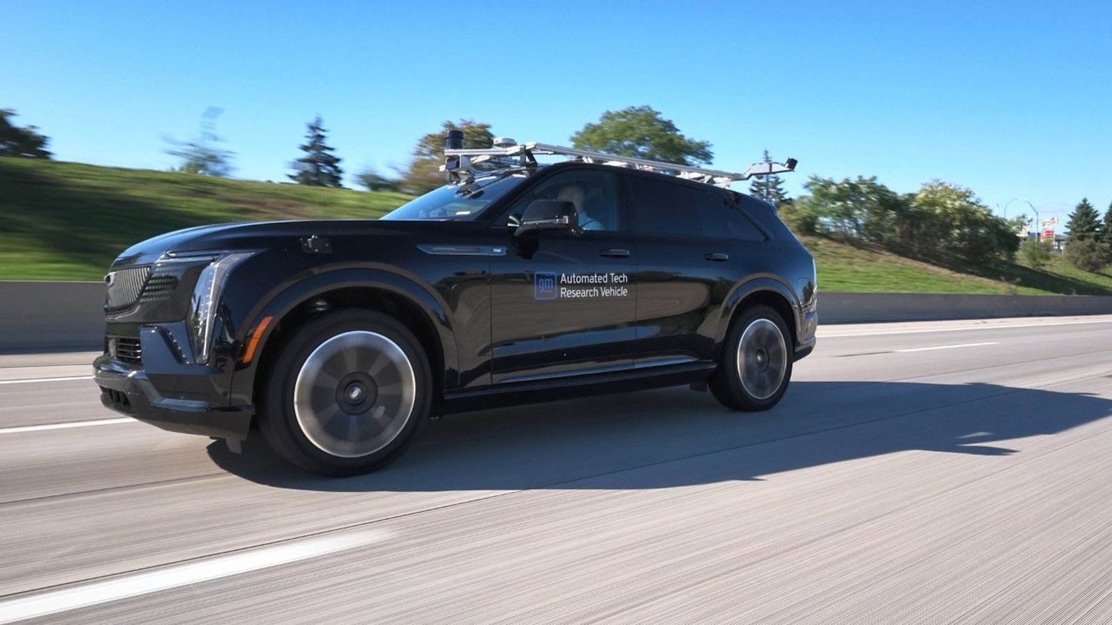 GM automated research vehicle with roof sensor rack testing eyes-off autonomous highway driving